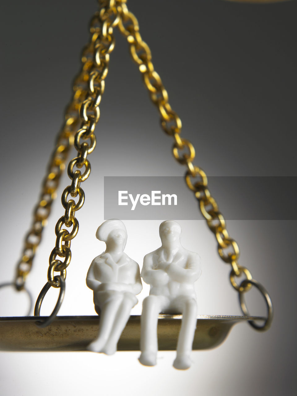 CLOSE-UP OF CHAIN ON TABLE
