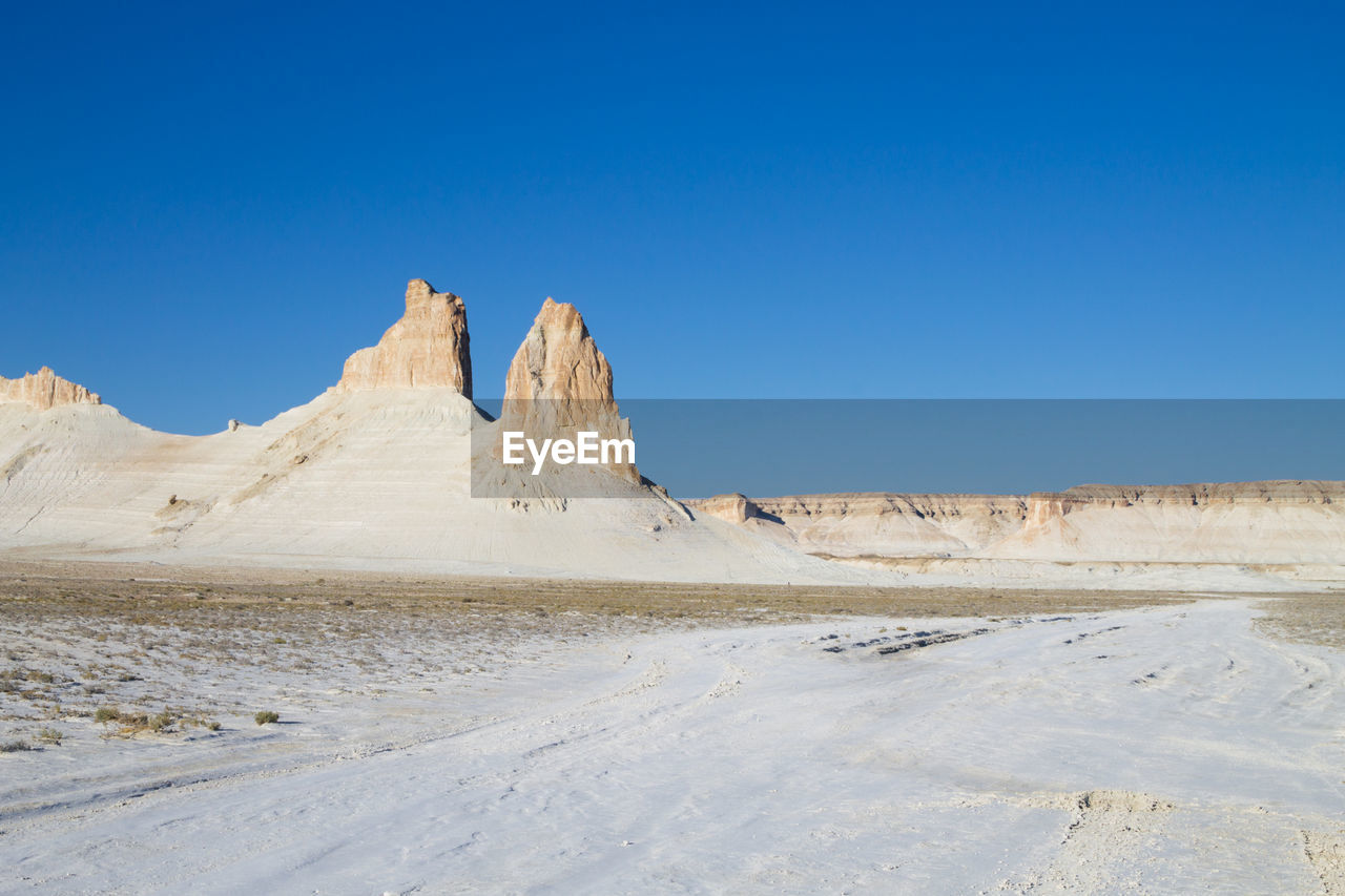 scenic view of desert against clear sky