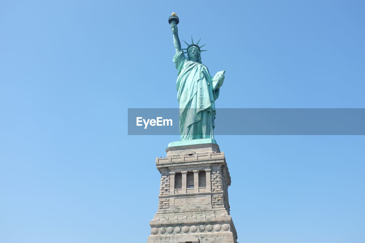 Statue of liberty against clear blue sky