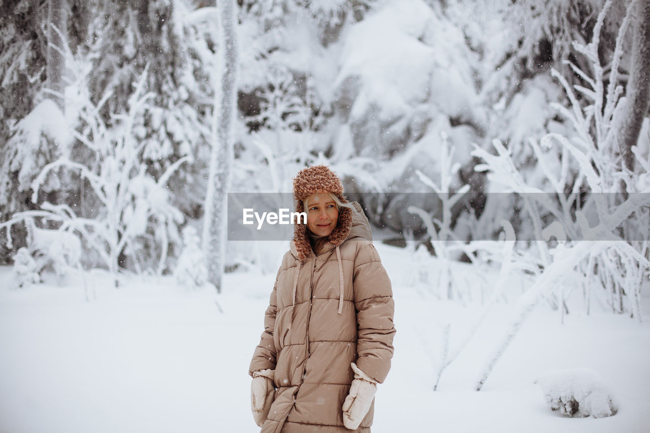 Portrait of a young girl in the winter forest