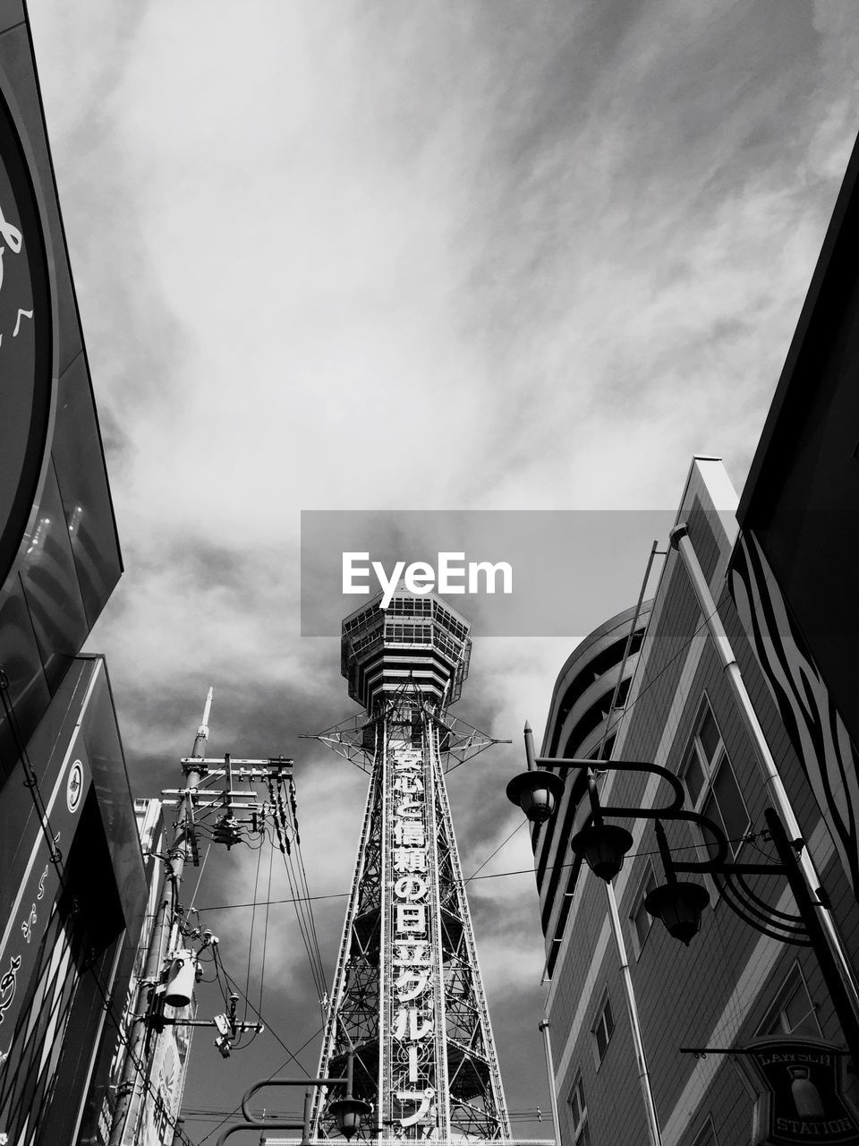 LOW ANGLE VIEW OF TOWER AGAINST CLOUDY SKY