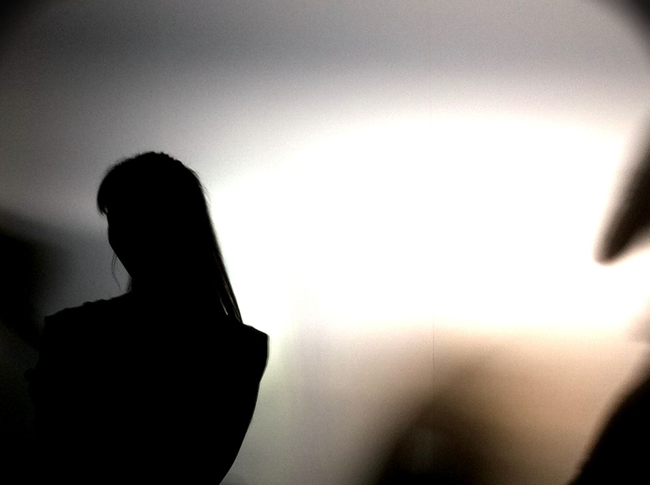 Close-up of a silhouette person against clear sky