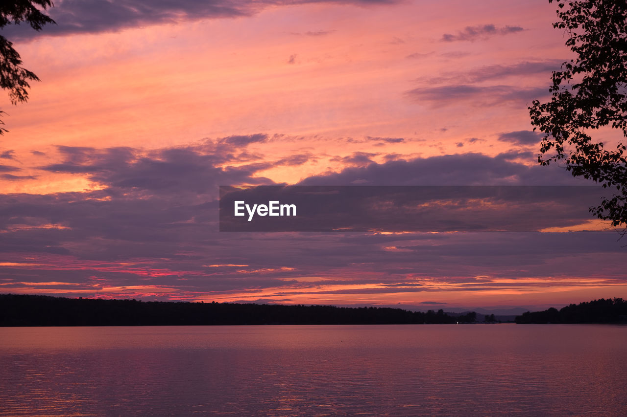 Scenic view of lake against sky during sunset