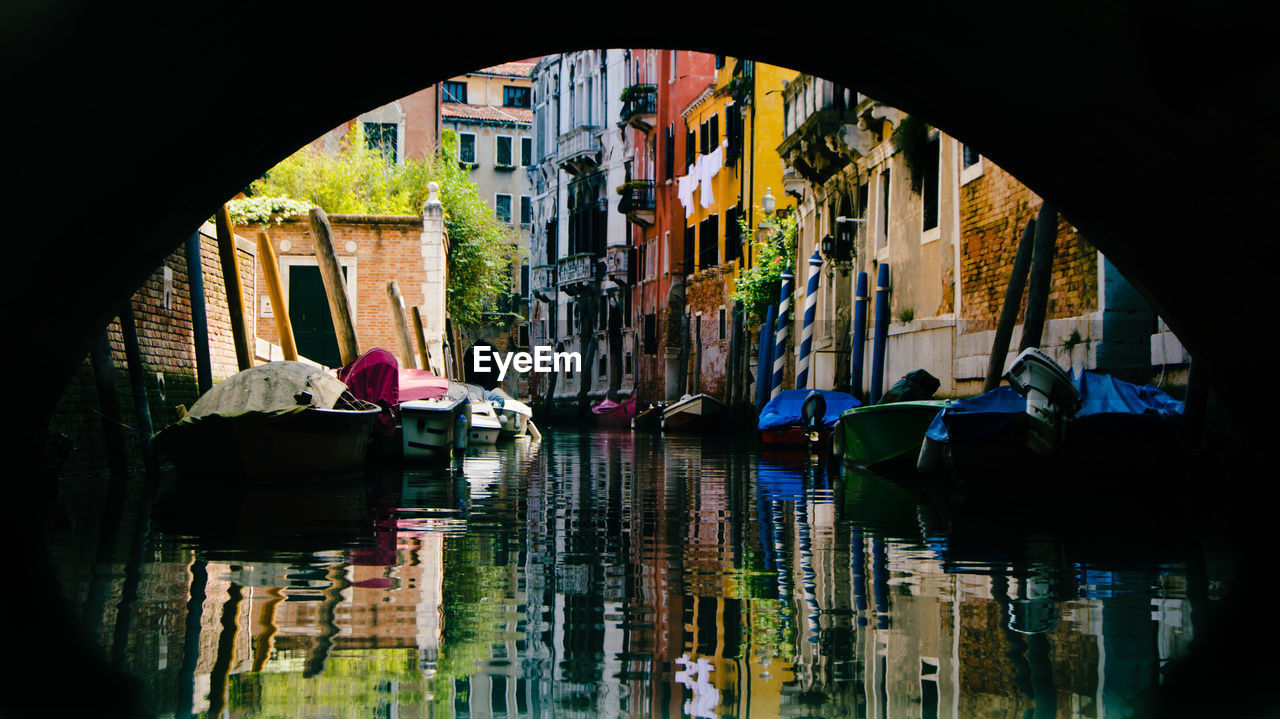 VIEW OF BUILDINGS SEEN THROUGH WINDOW