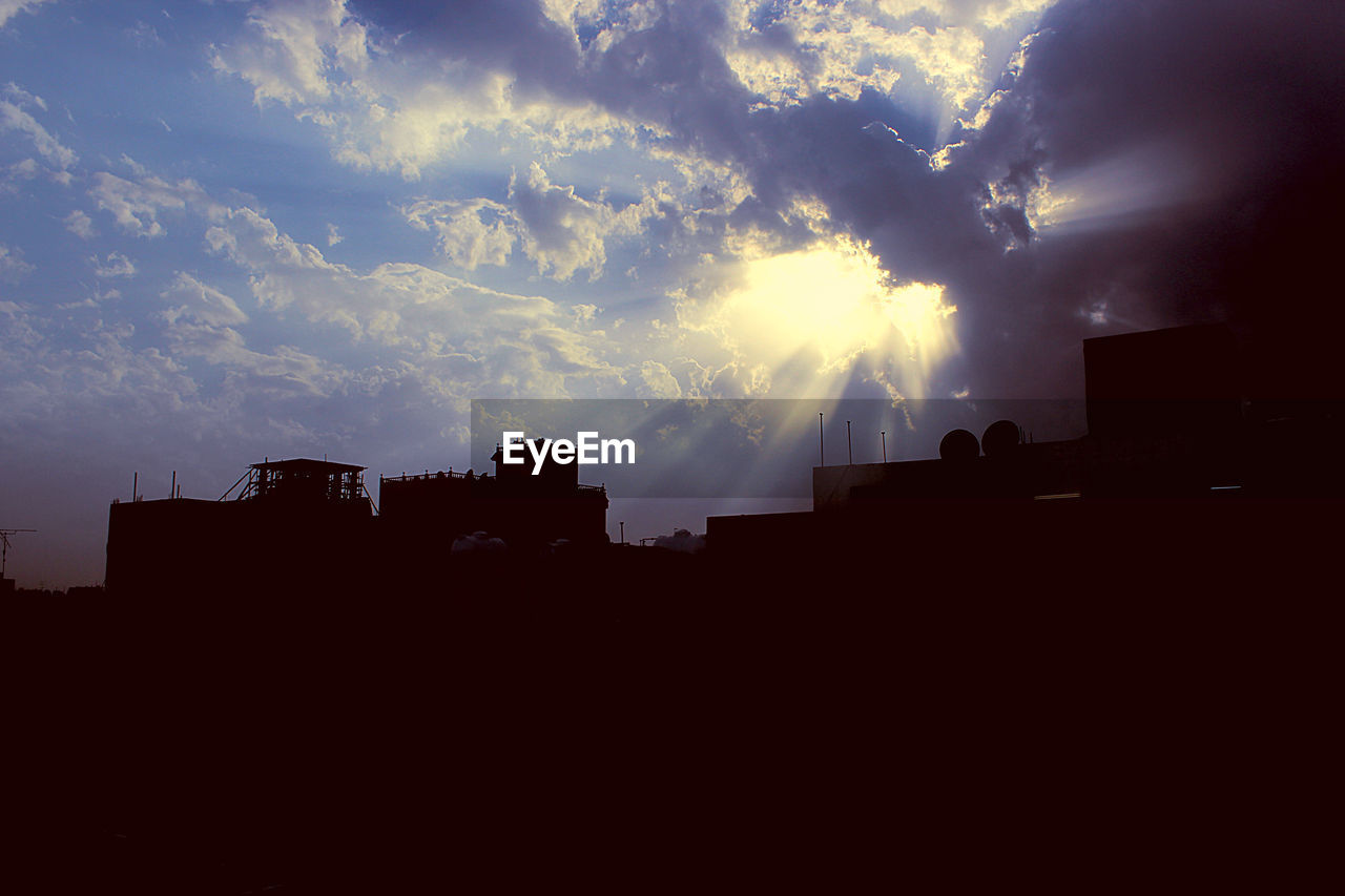 SILHOUETTE OF BUILDINGS AT SUNSET