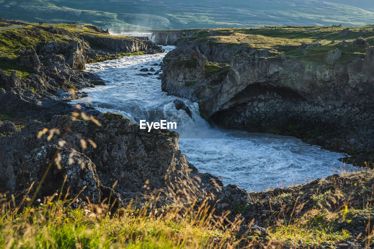 SCENIC VIEW OF ROCKS AT SEA SHORE