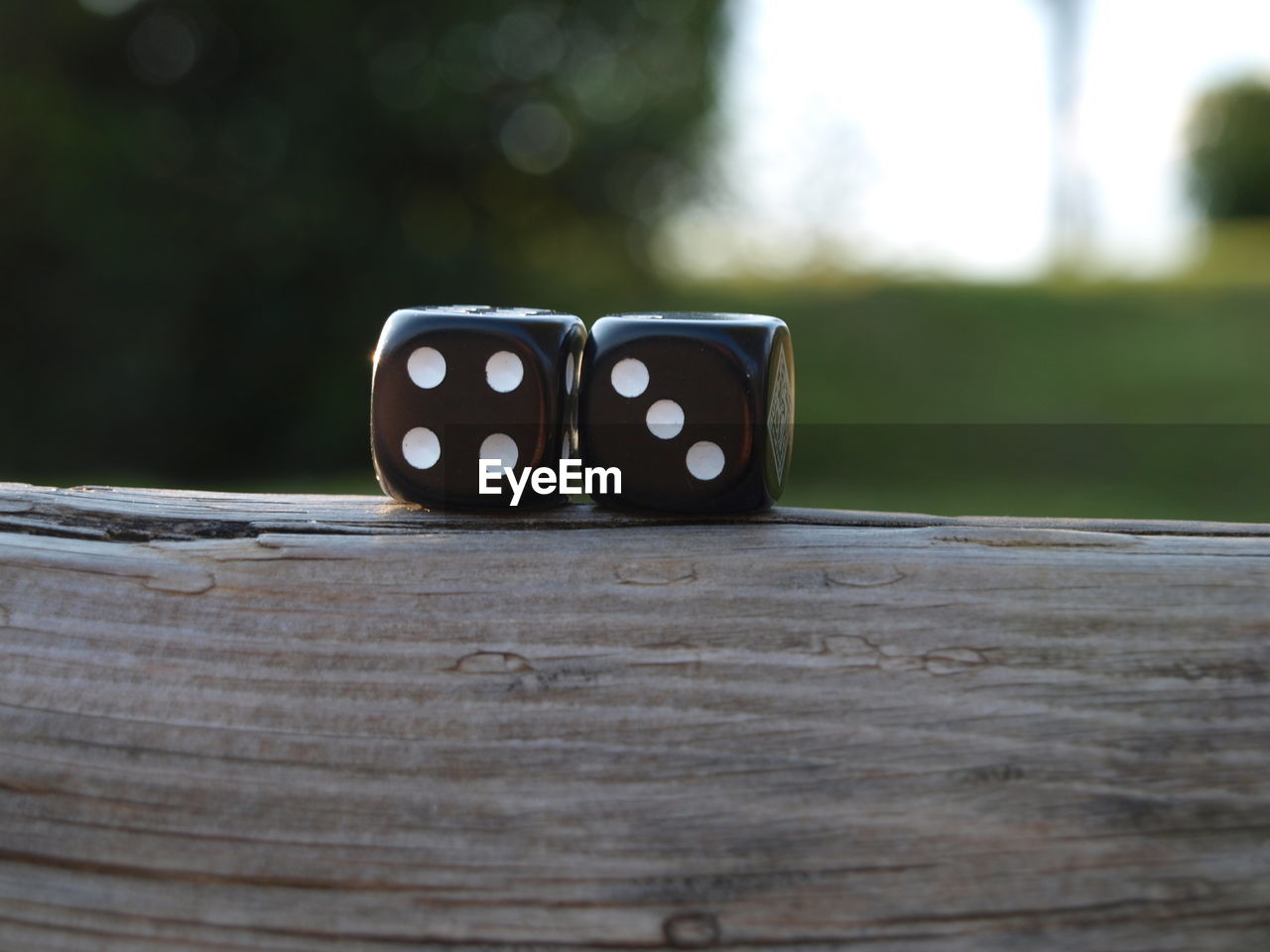 Close-up of dice on wooden table