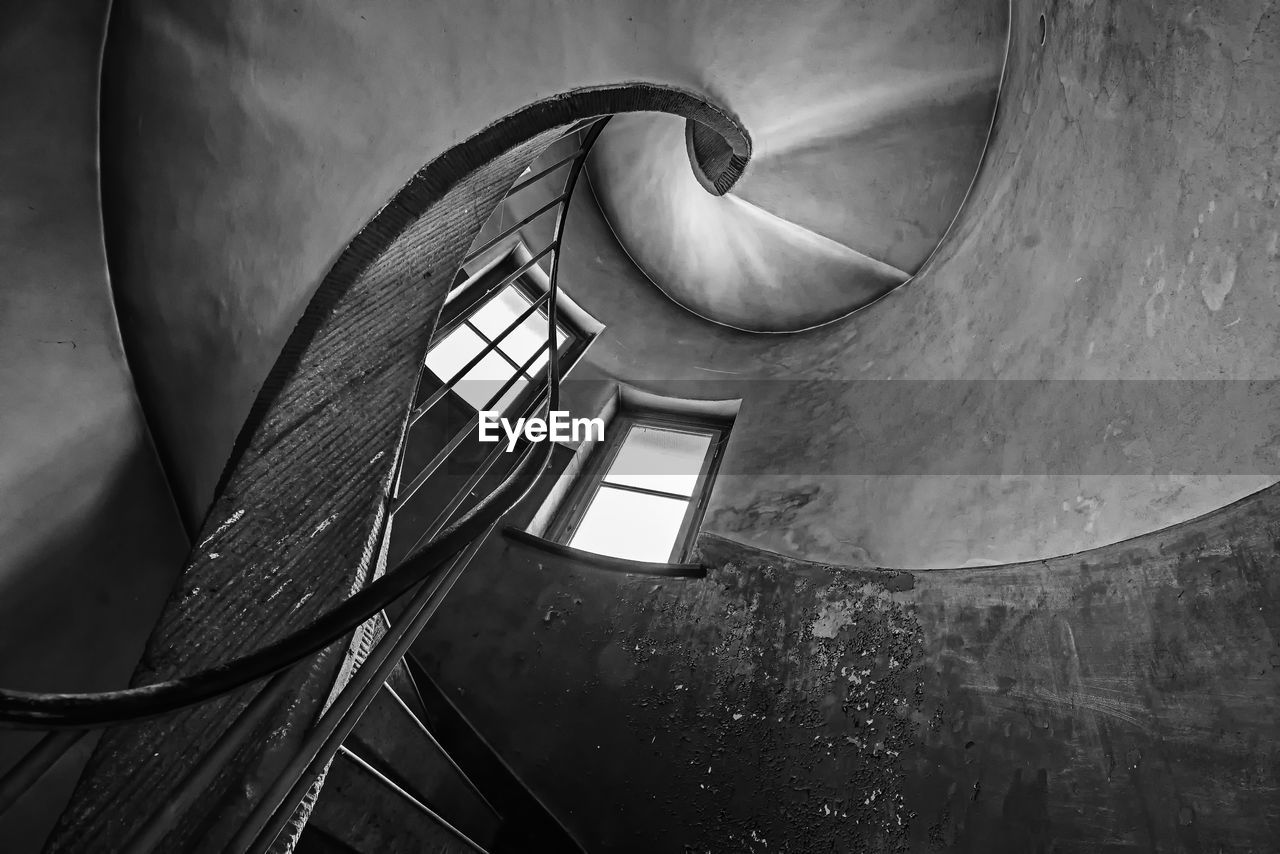 black, darkness, black and white, monochrome, white, monochrome photography, staircase, steps and staircases, spiral, spiral staircase, architecture, light, built structure, railing, no people, indoors, low angle view, curve
