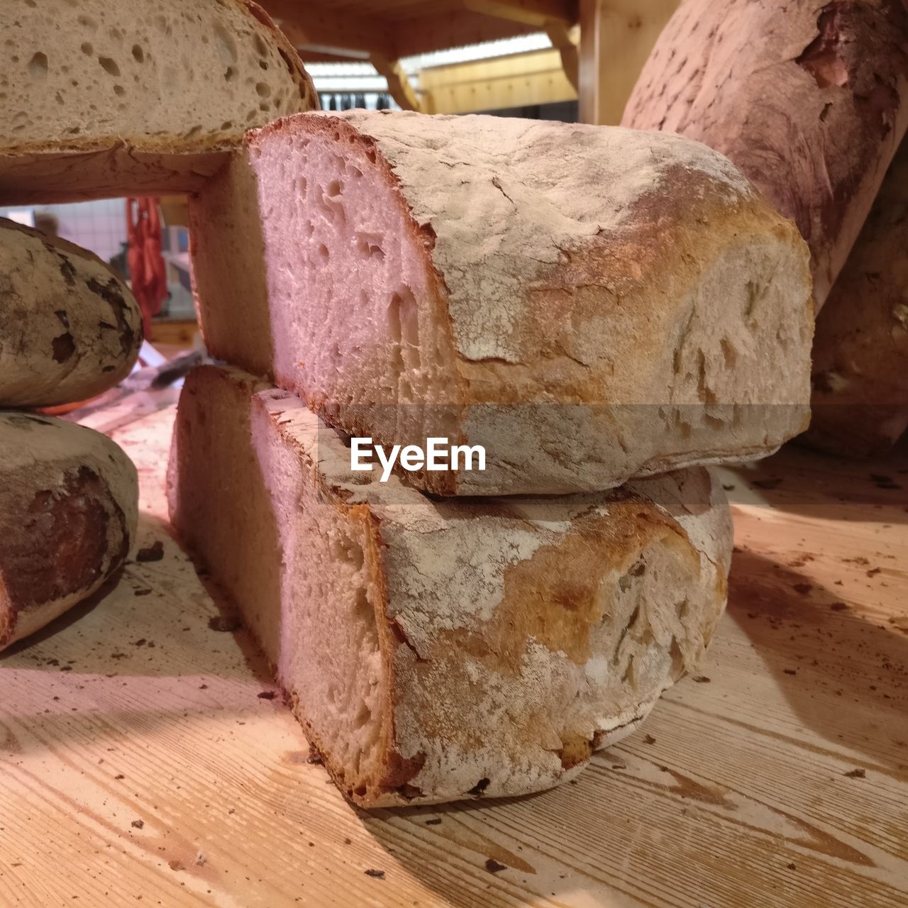 CLOSE-UP OF BREAD ON WOODEN TABLE