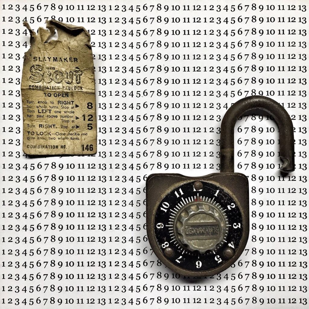 Close-up of padlock on numbered sheet