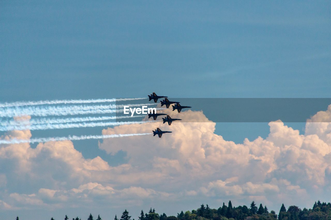 LOW ANGLE VIEW OF AIRPLANE AGAINST SKY