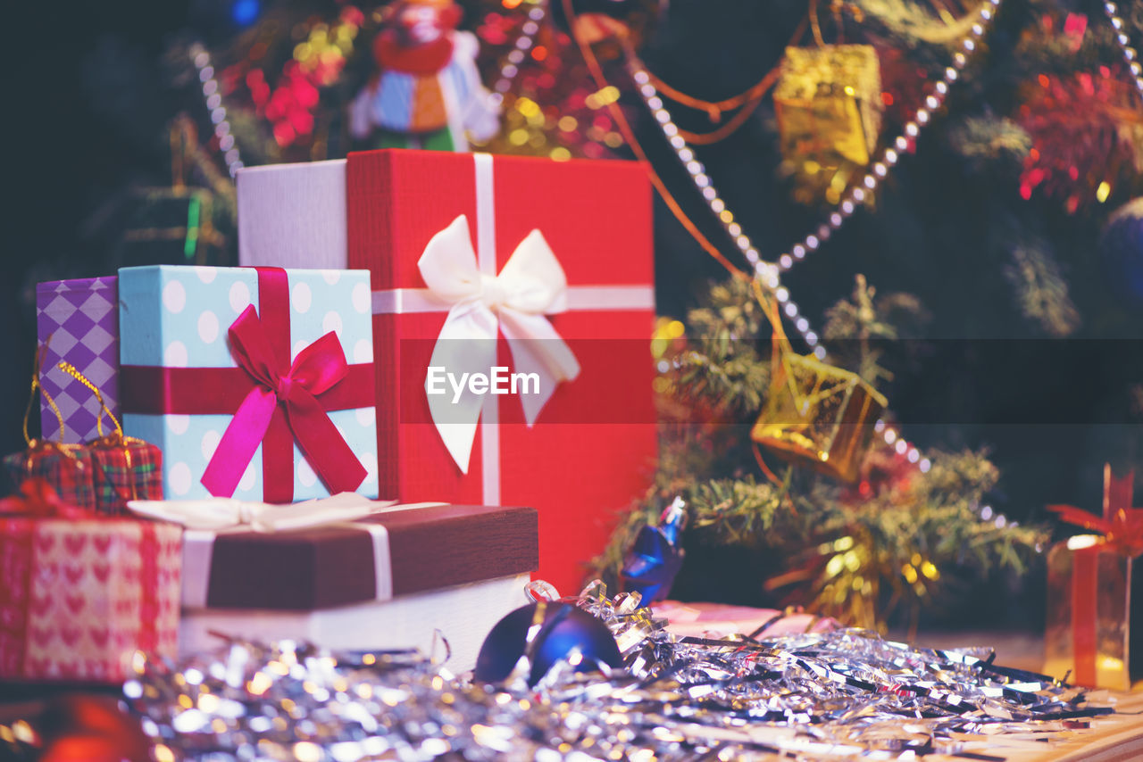 Close-up of christmas decoration on table over black background