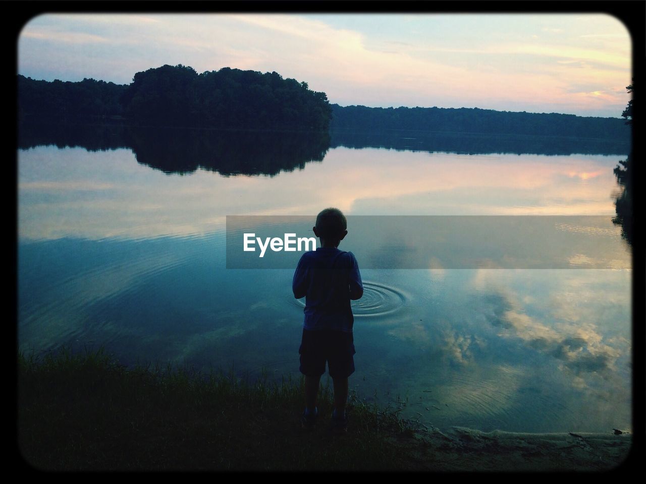 Boy by lake