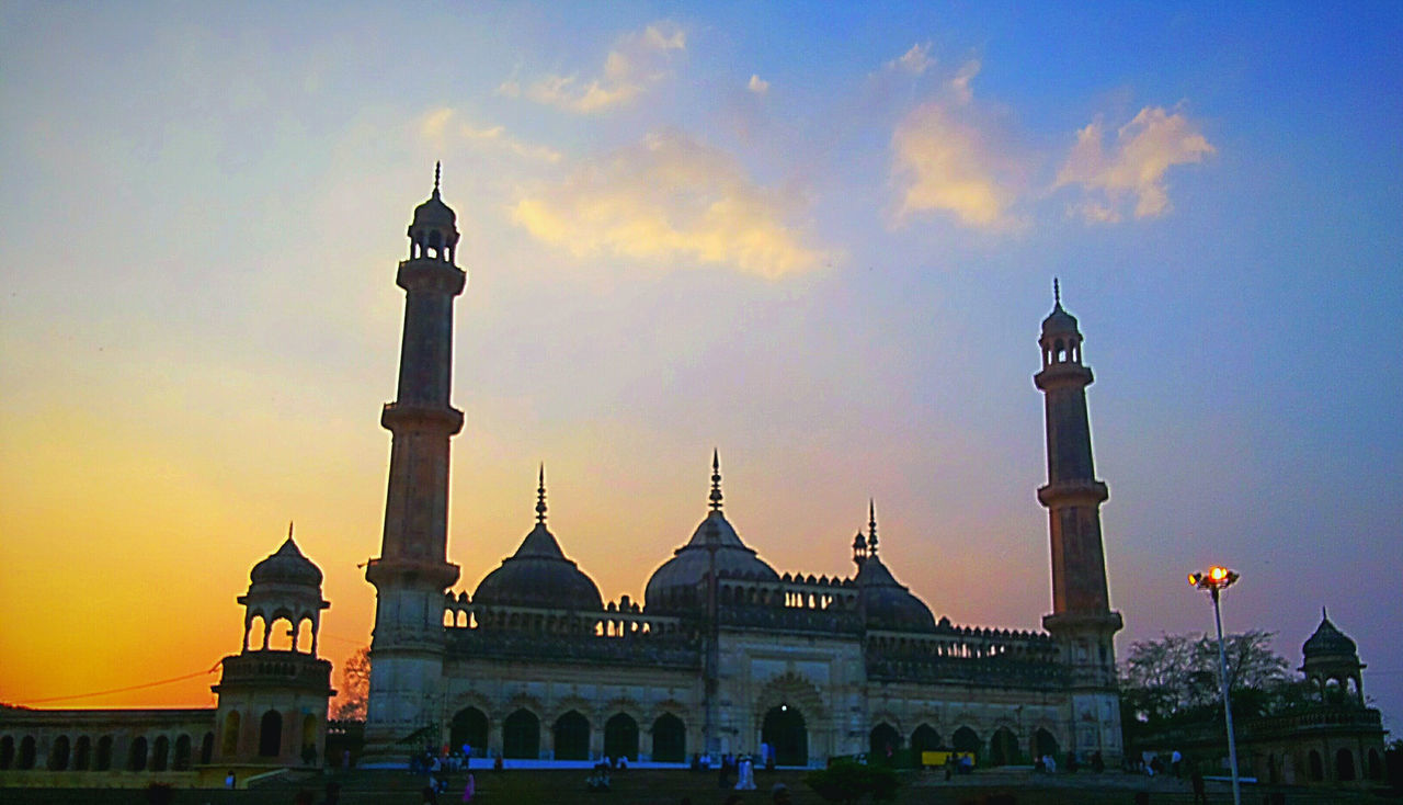 LOW ANGLE VIEW OF MOSQUE AT SUNSET