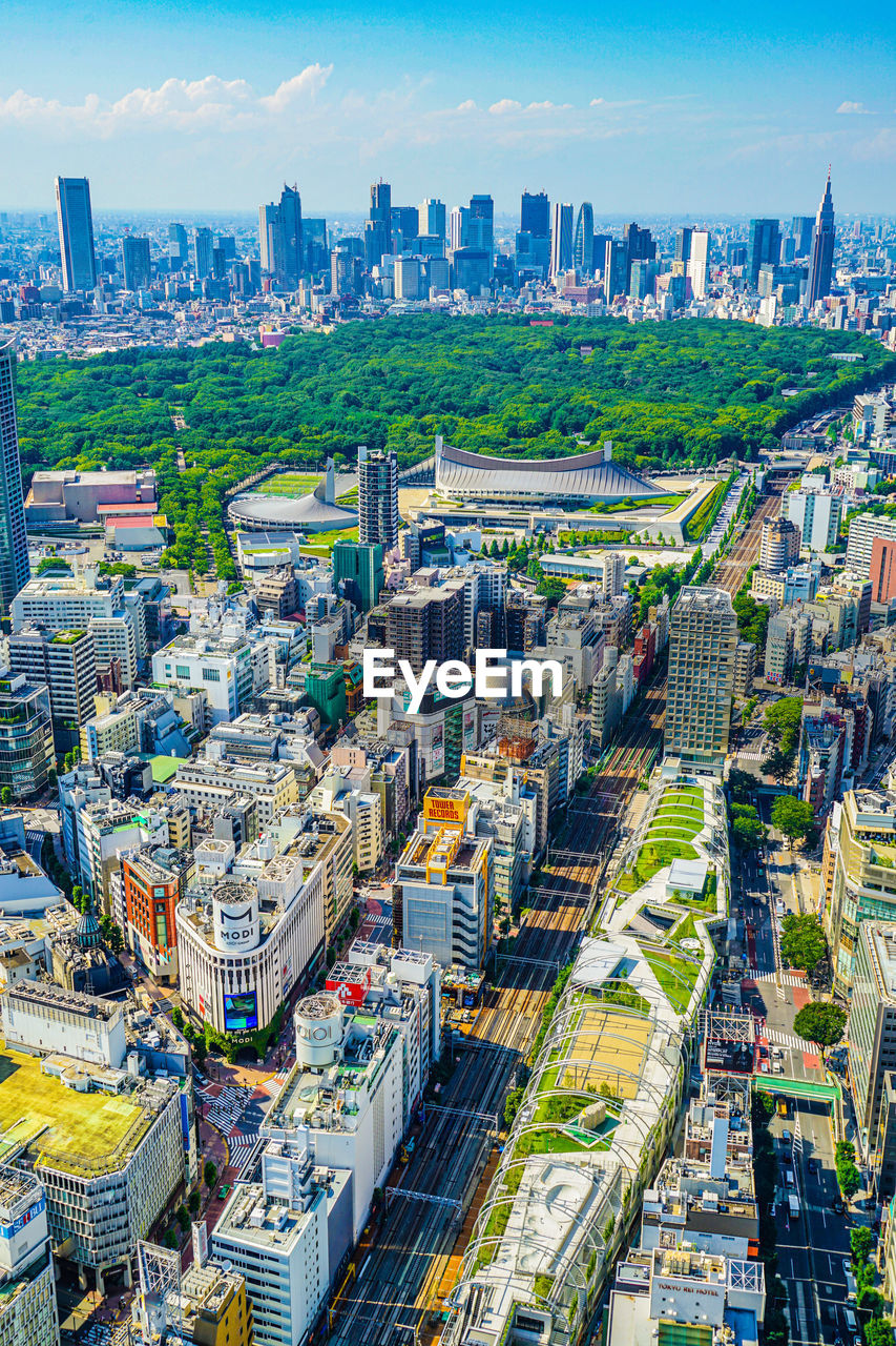 HIGH ANGLE VIEW OF MODERN BUILDINGS IN CITY