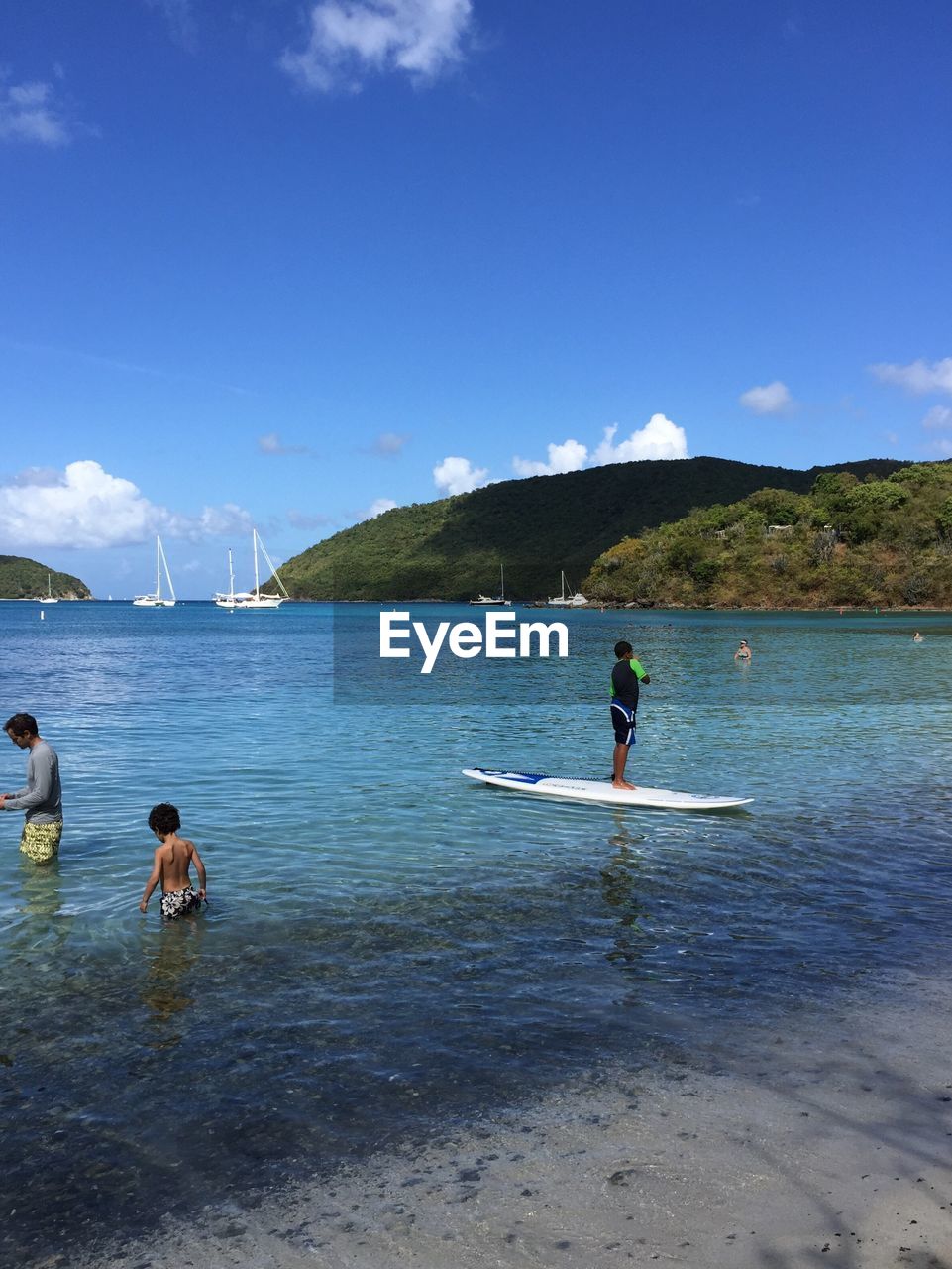 PEOPLE ENJOYING AT BEACH