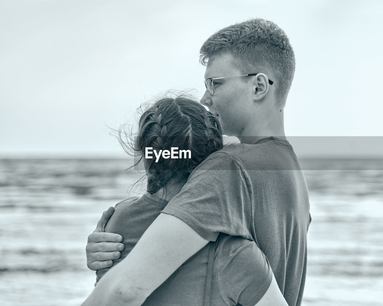 Rear view of couple at beach