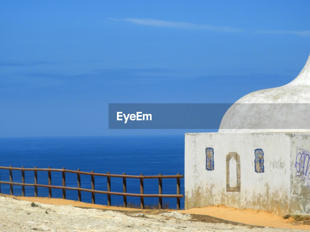 Scenic view of sea against blue sky