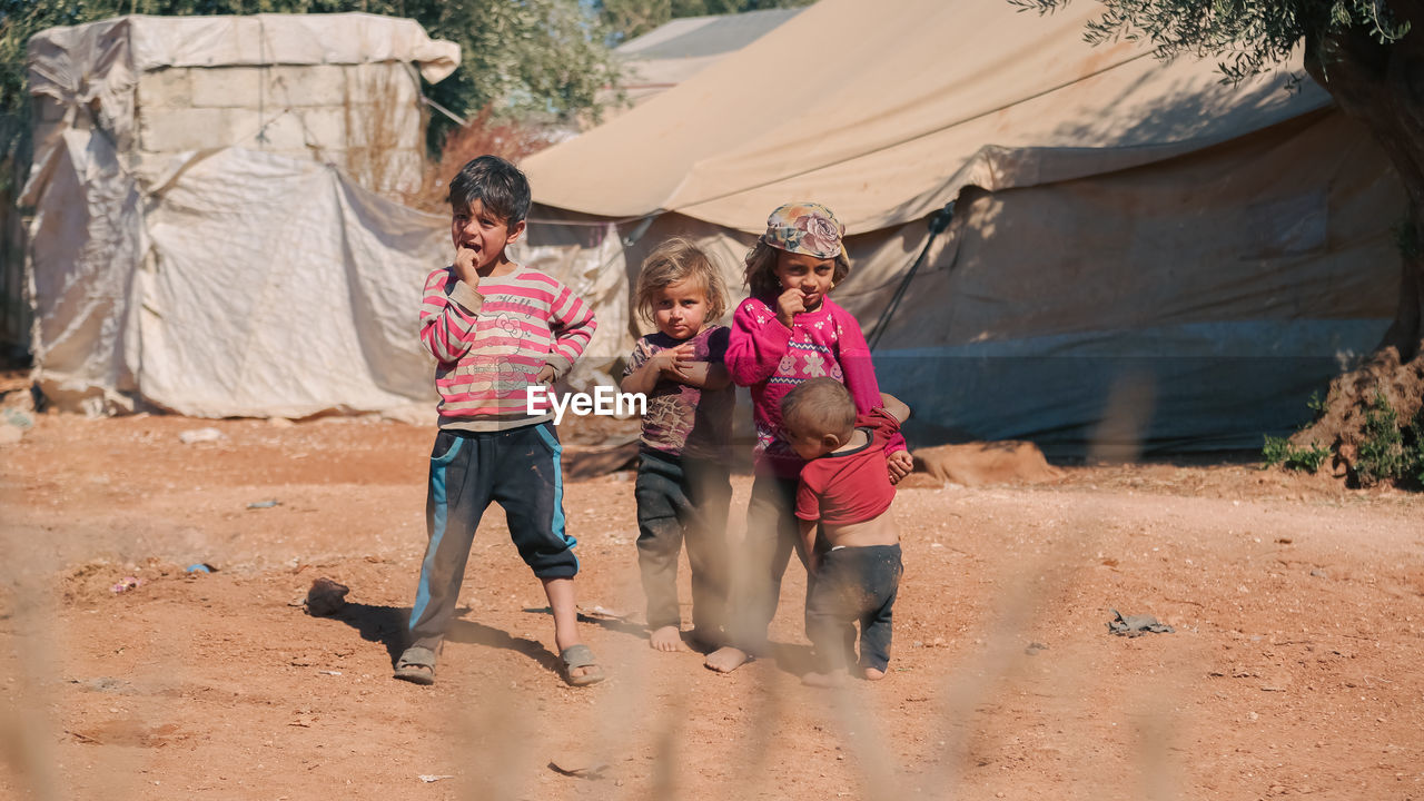 Syrian children inside their tent in the middle of a refugee camp near the turkish border.