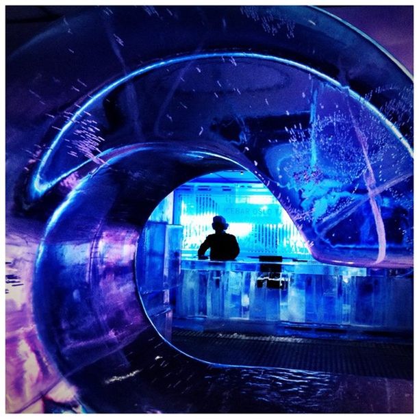 VIEW OF ILLUMINATED PEOPLE IN BACKGROUND