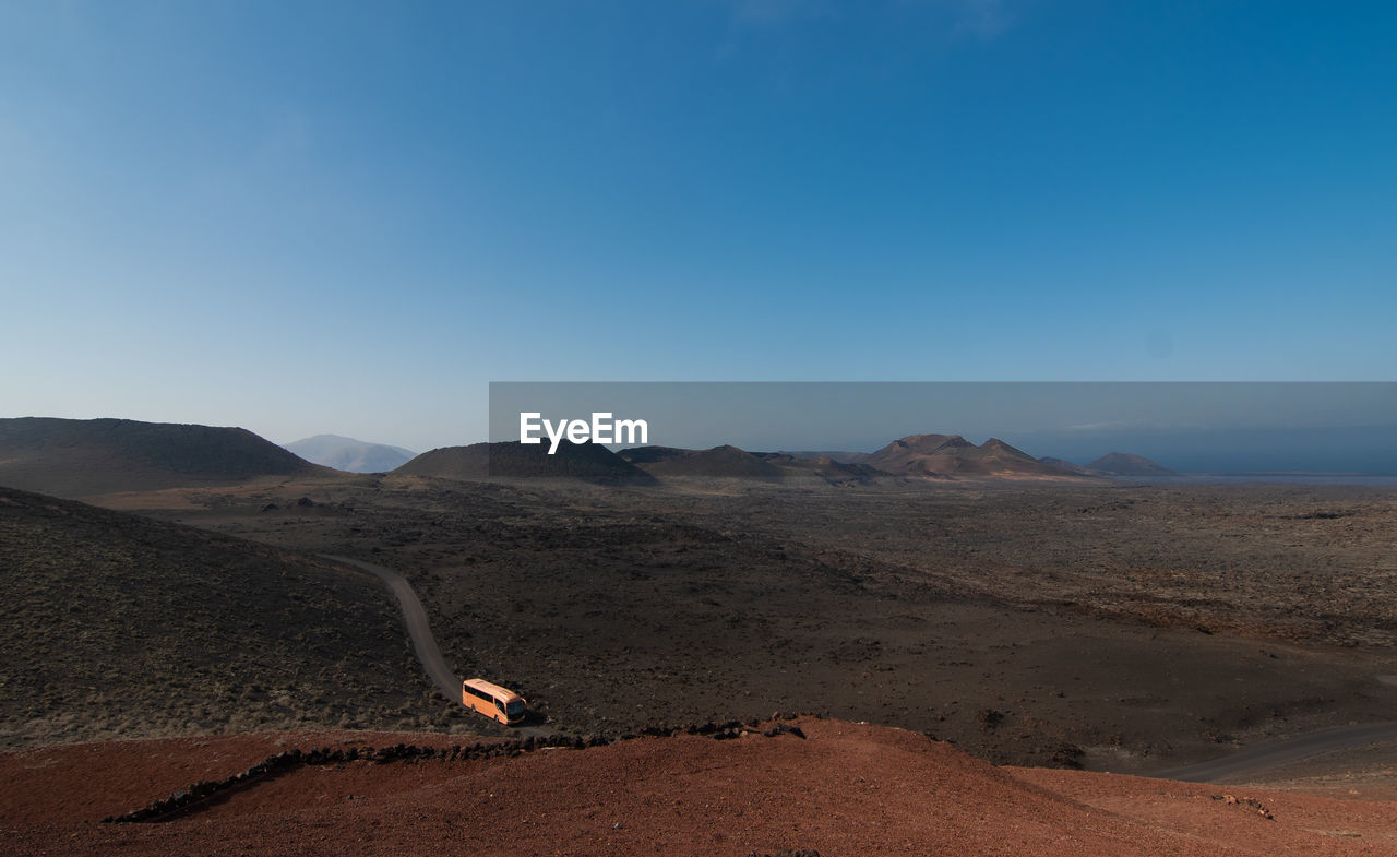 scenic view of desert against clear sky