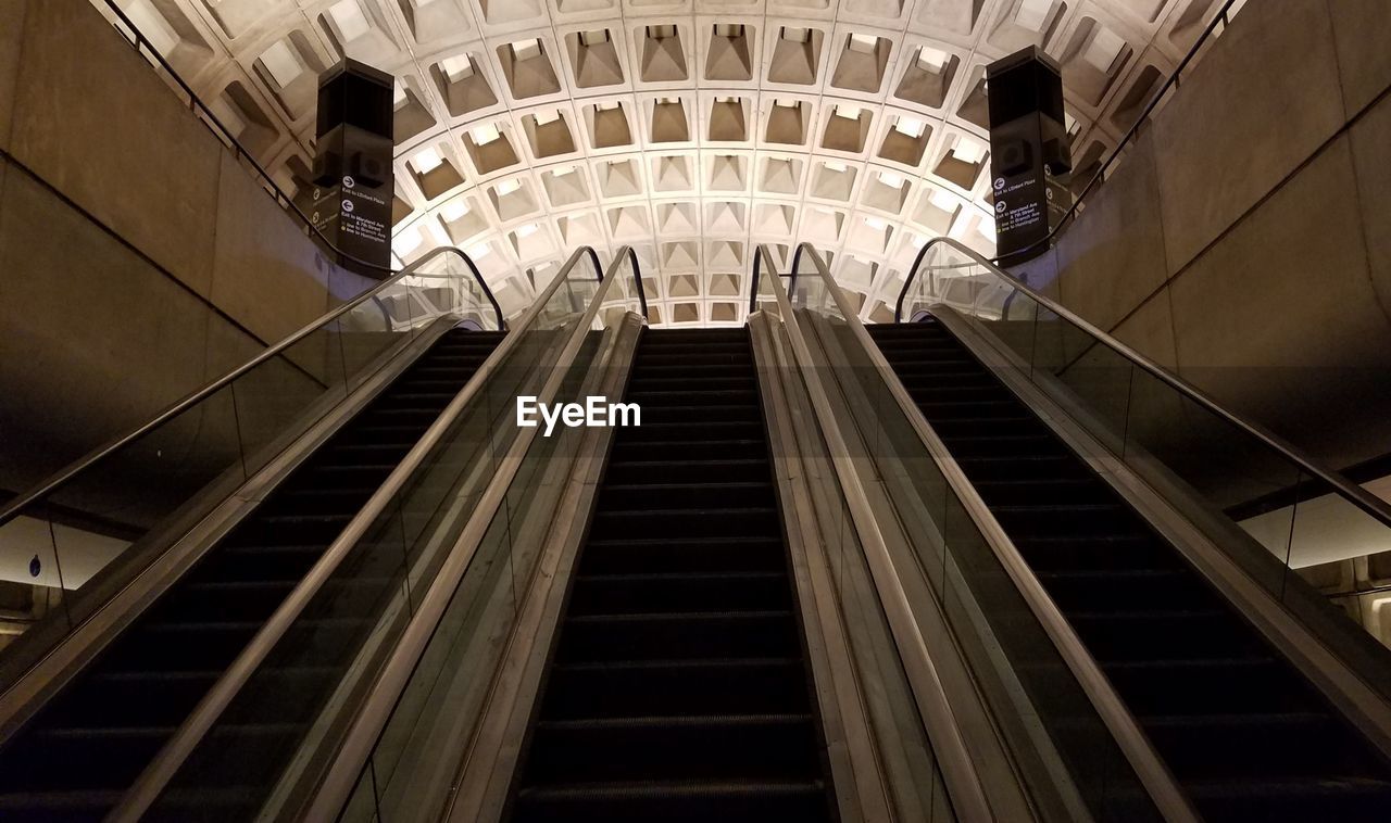 LOW ANGLE VIEW OF ESCALATOR IN CITY