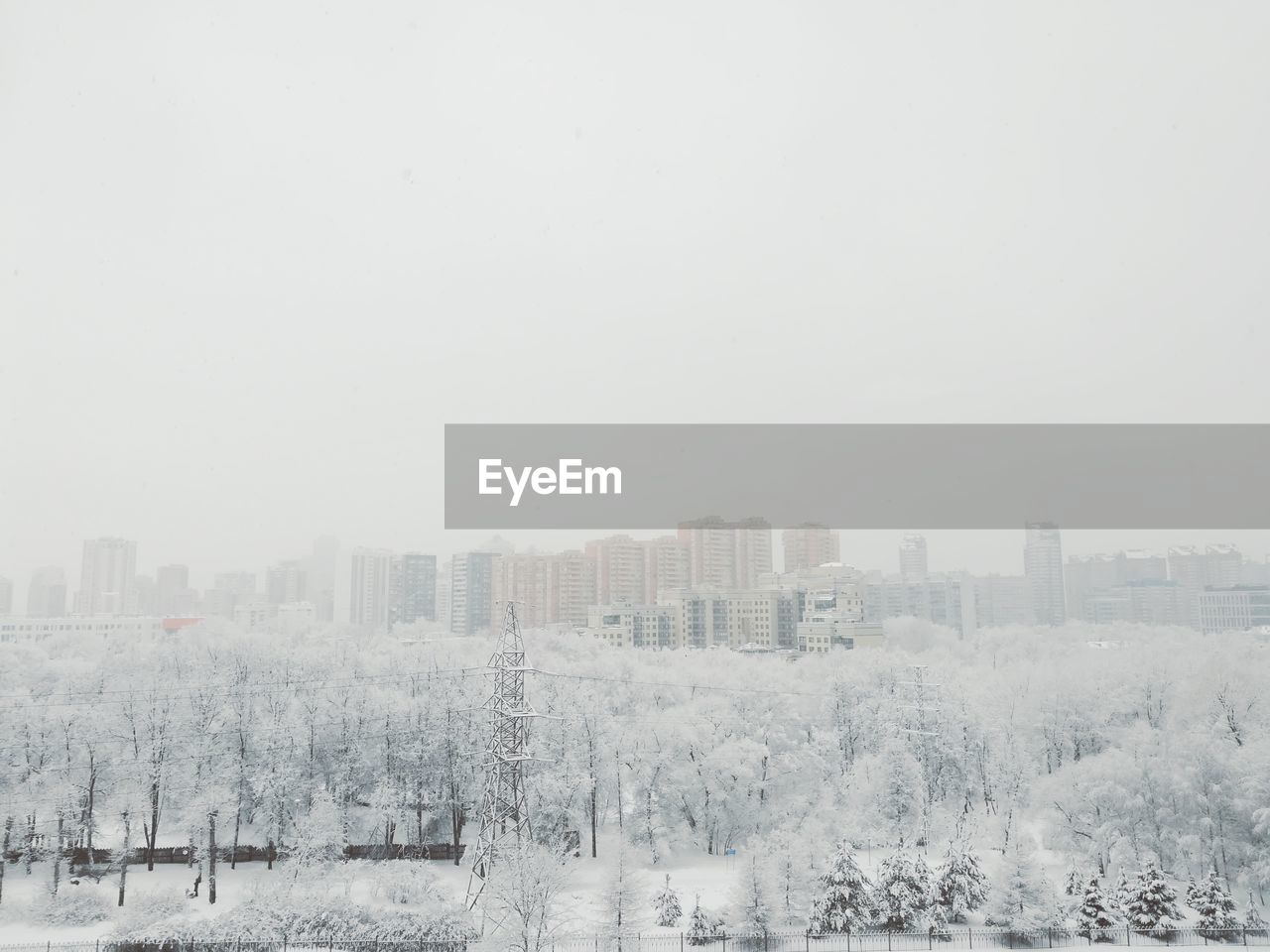 BUILDINGS IN CITY AGAINST SKY
