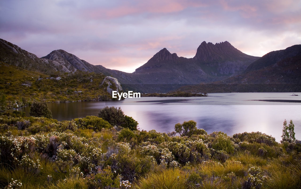 Scenic view of lake against sky during sunset