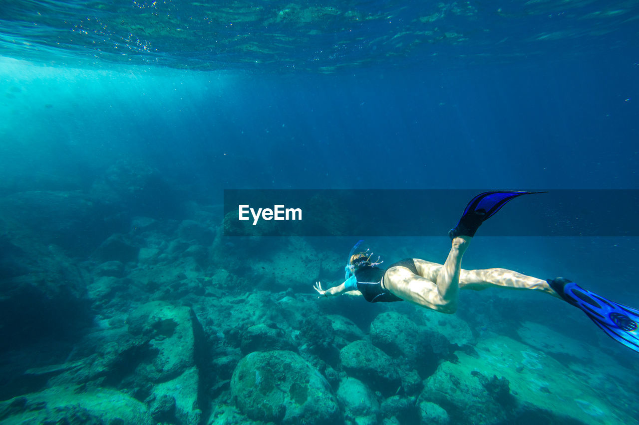 Woman swimming in sea