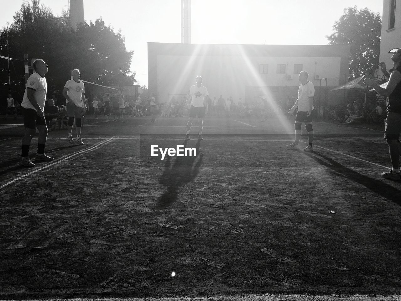 People playing at ground during sunny day