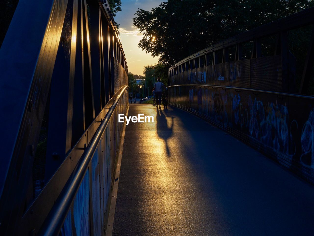 Silhouette of bridge against sky at sunset