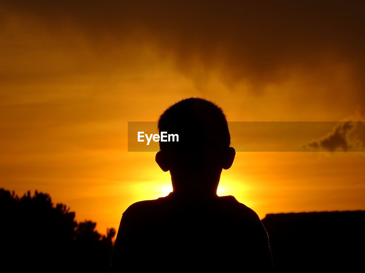 Silhouette man against sky during sunset