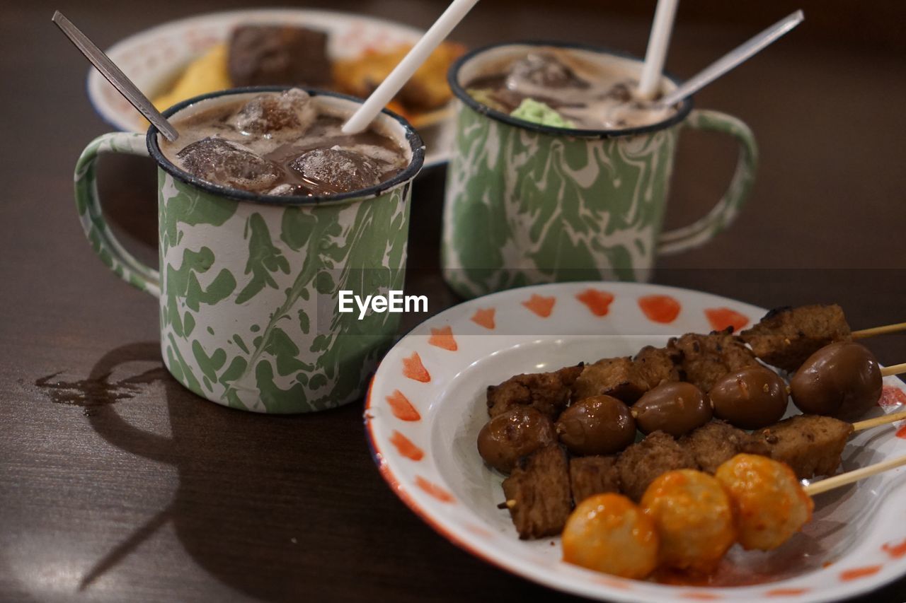 Close-up of food and drinks on table