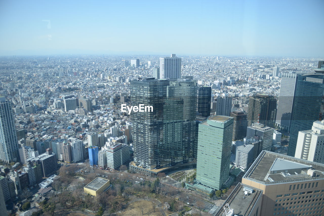 High angle view of modern buildings in city against sky