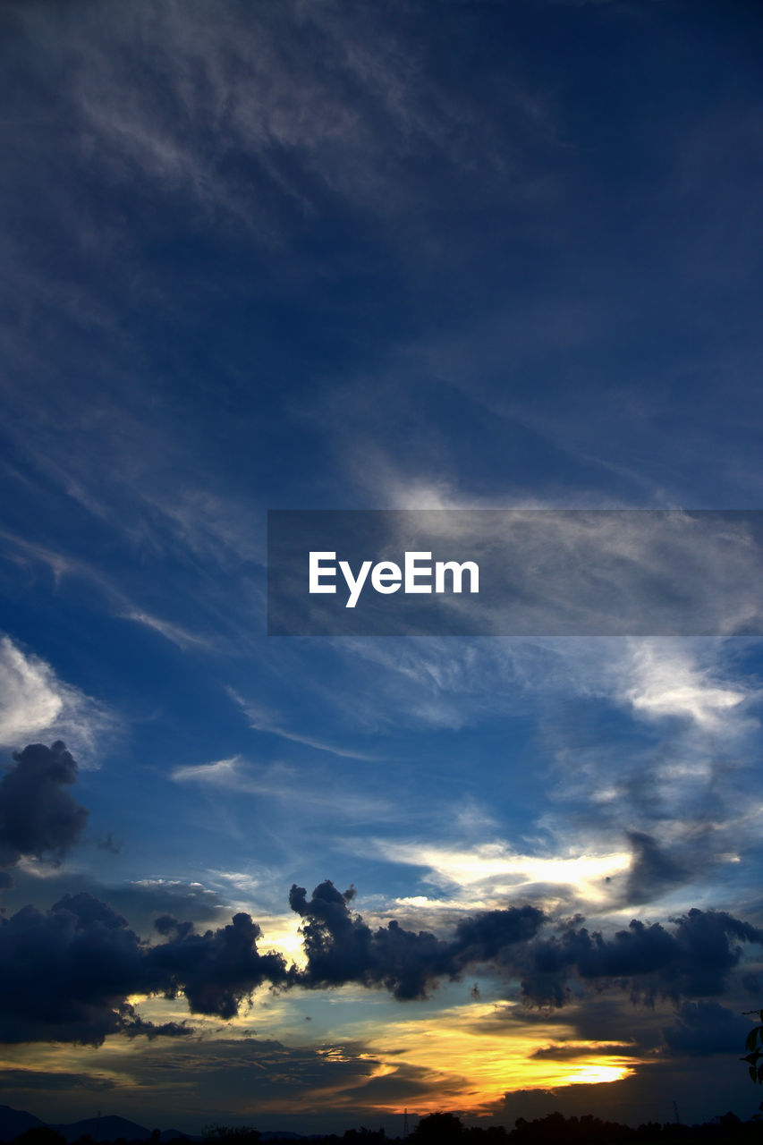 LOW ANGLE VIEW OF CLOUDY SKY AT SUNSET