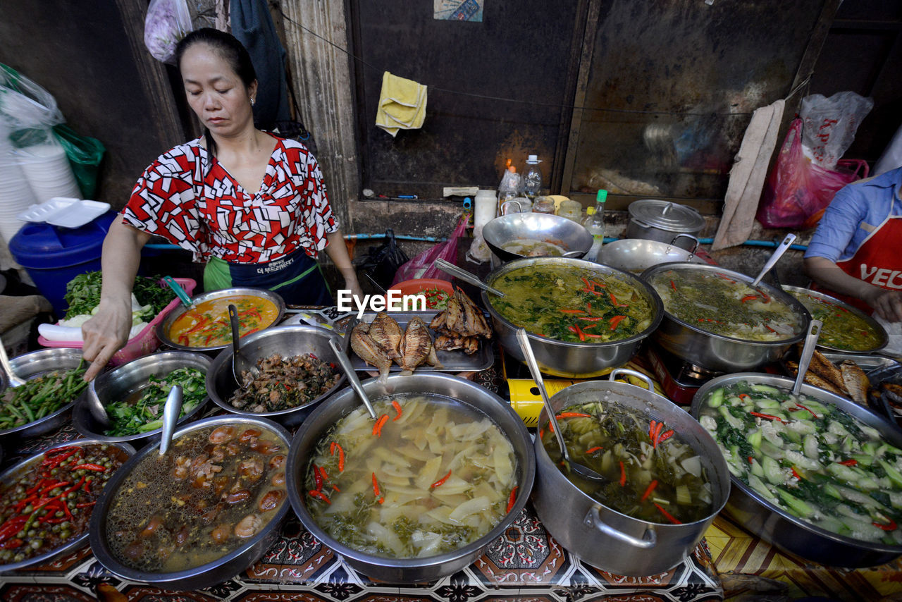 High angle view of woman selling food at market