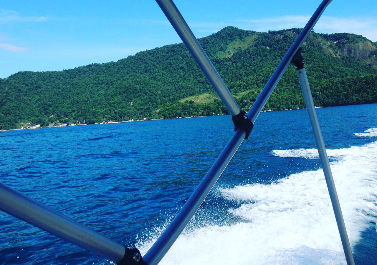 Boat sailing on sea against sky