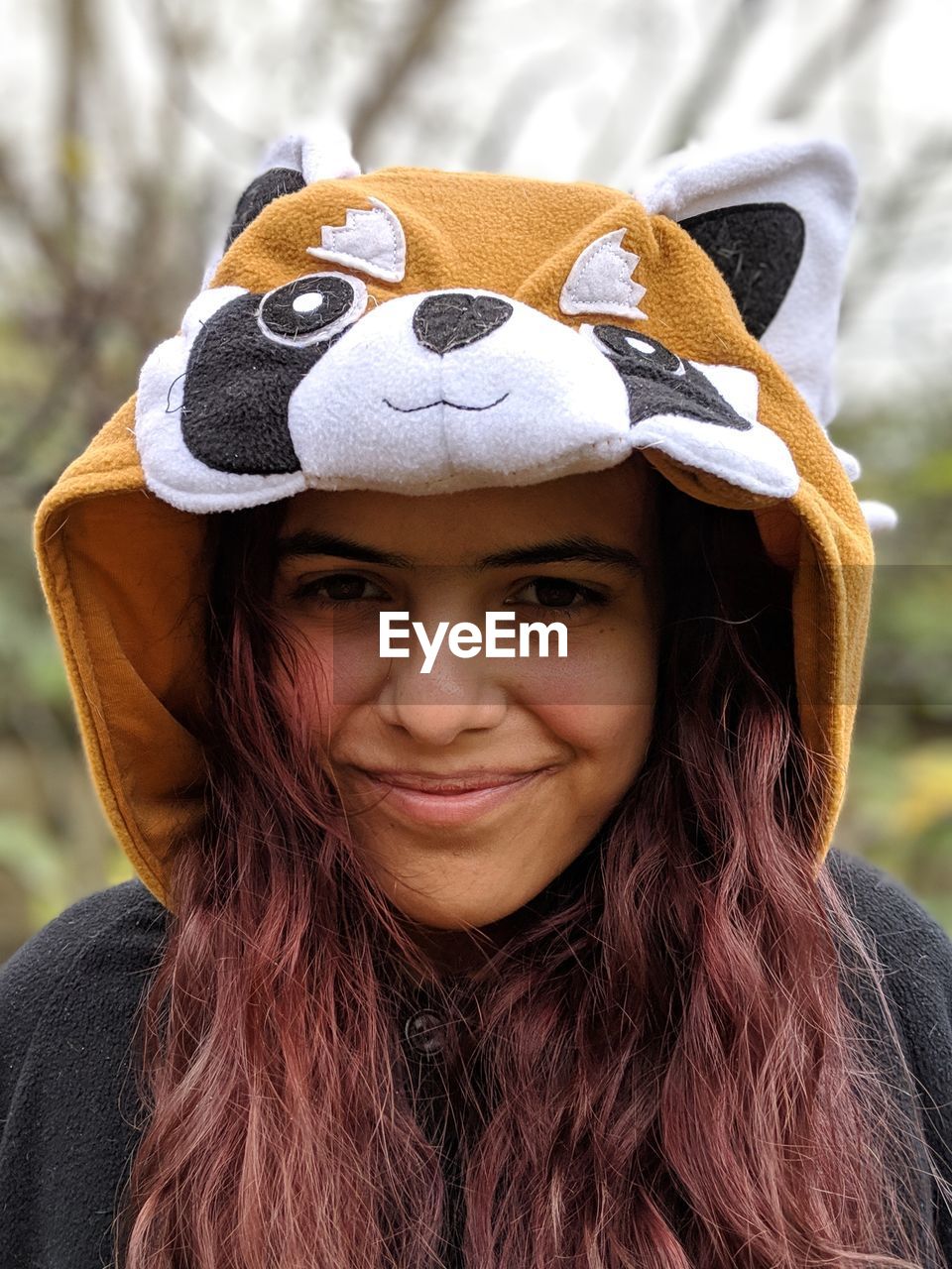 Close-up portrait of young woman wearing hood