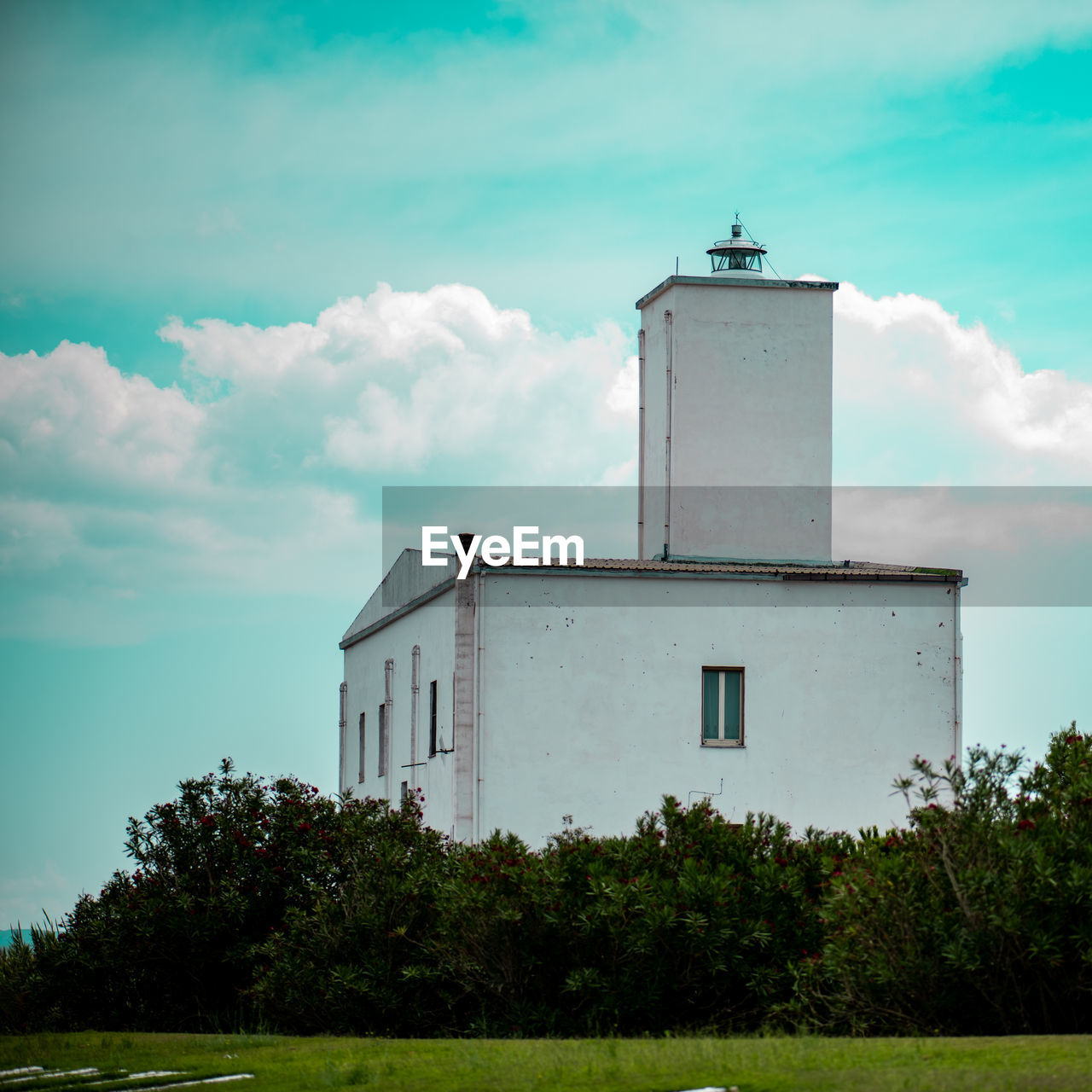 VIEW OF LIGHTHOUSE AGAINST BUILDING