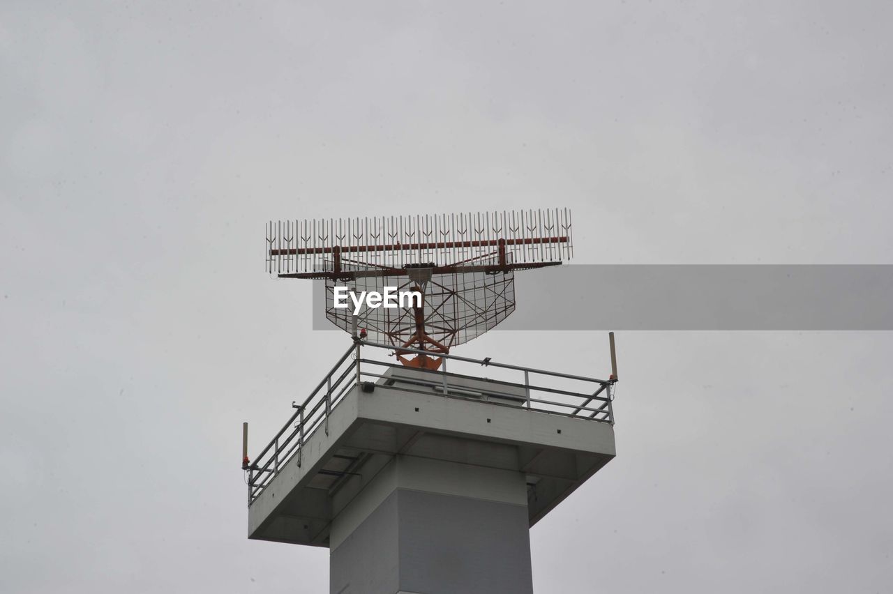 LOW ANGLE VIEW OF TELEPHONE POLE AGAINST SKY