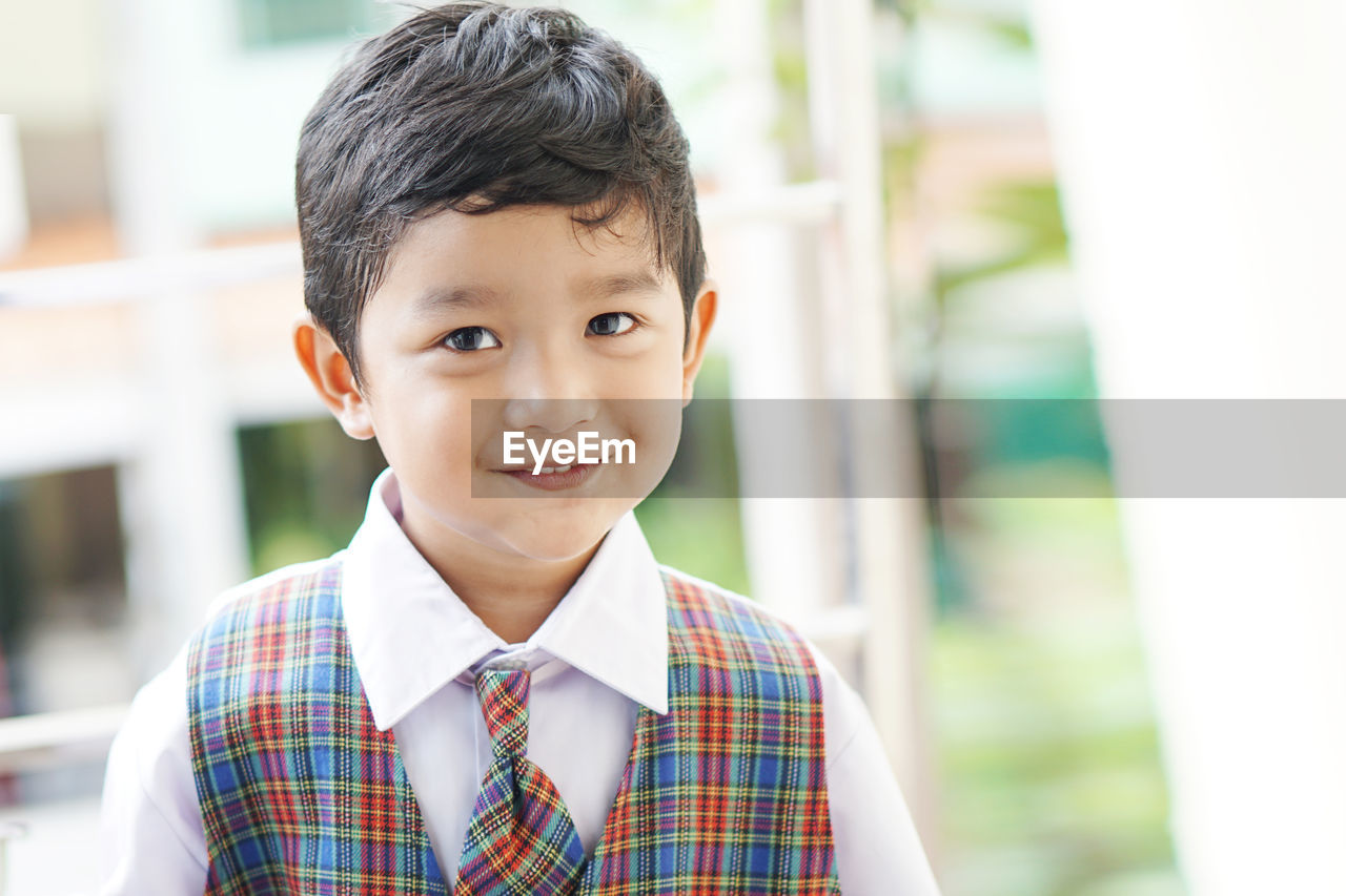 PORTRAIT OF BOY SMILING