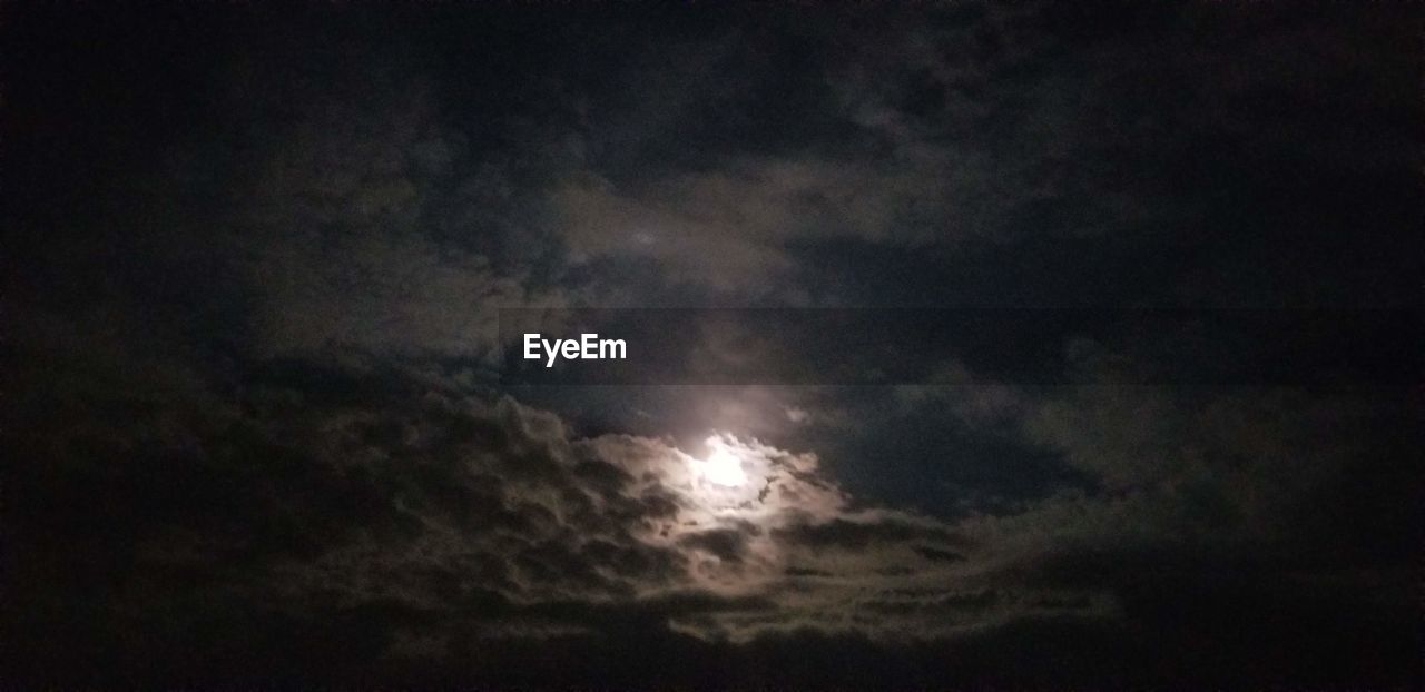 LOW ANGLE VIEW OF MOON IN SKY