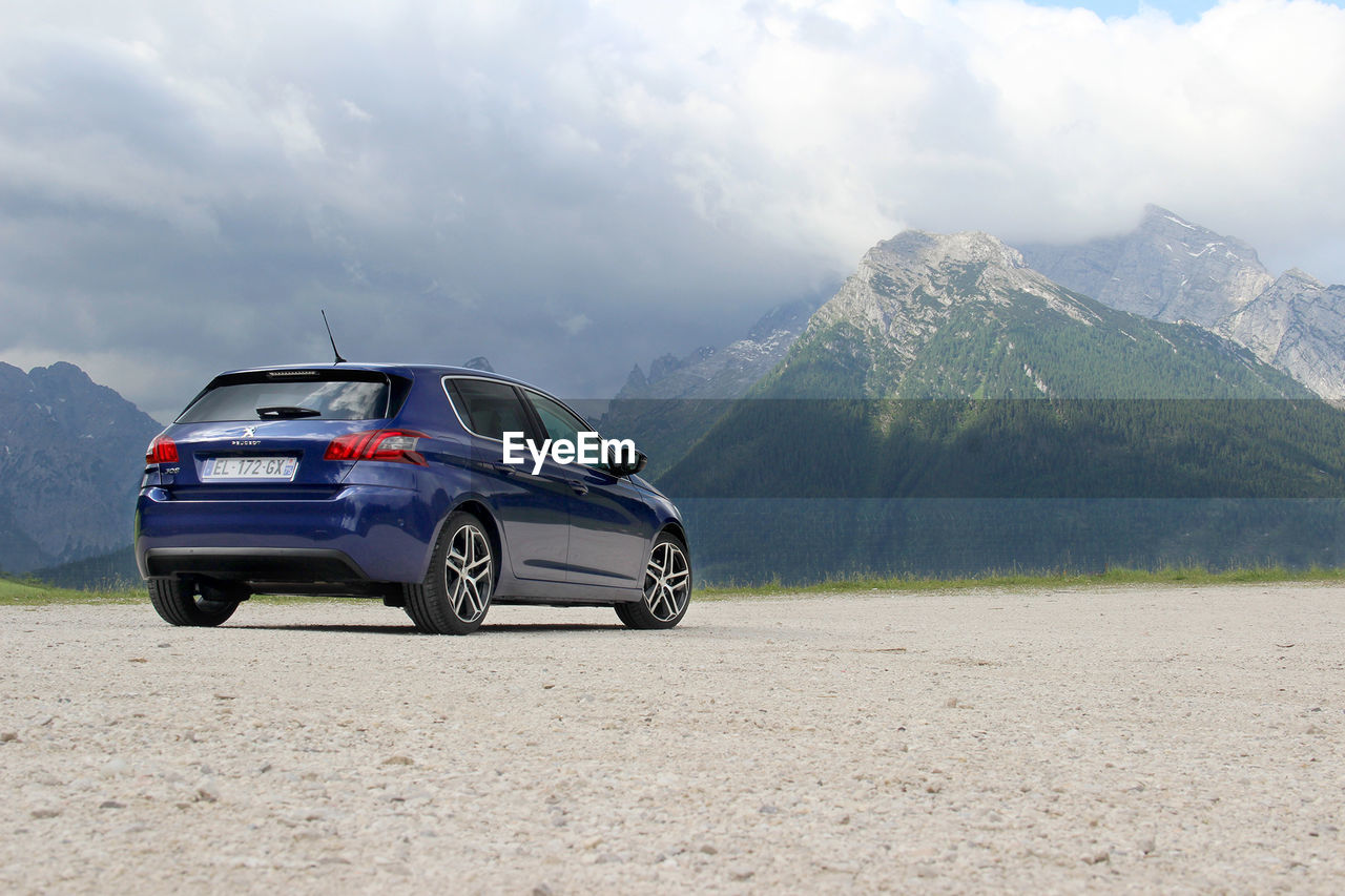 Car on mountain against sky