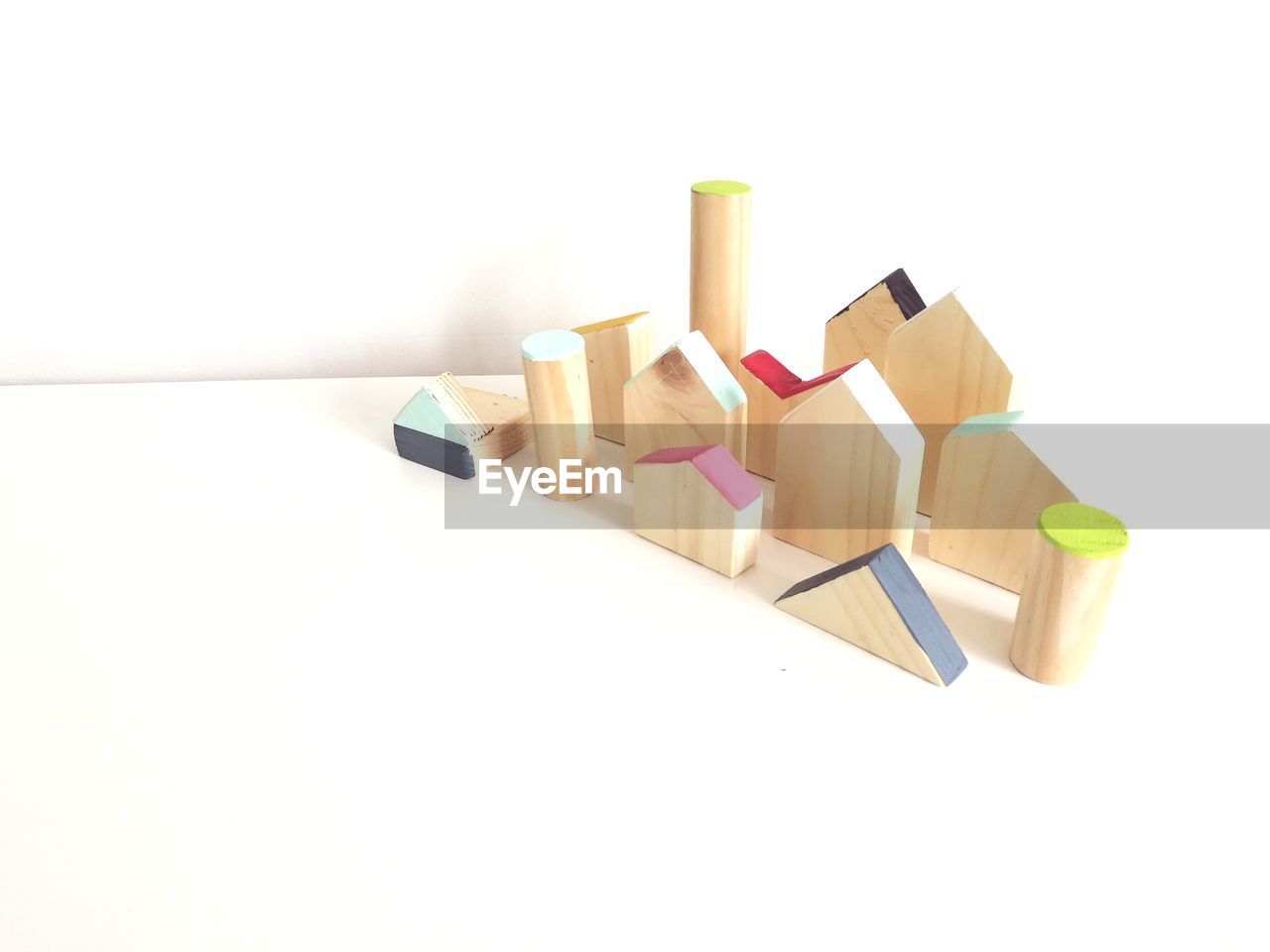 High angle view of wooden toys against white background