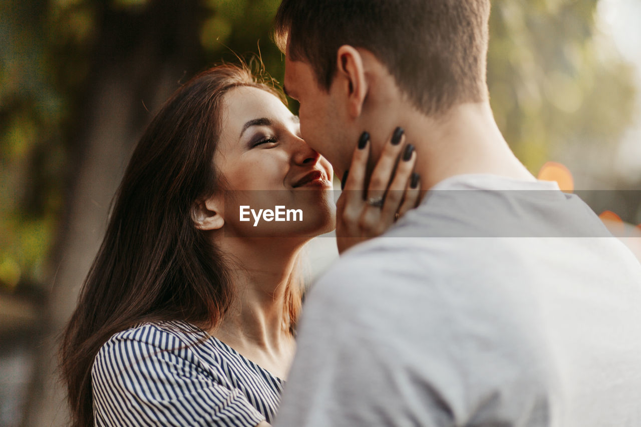 Close-up of young couple rubbing noses