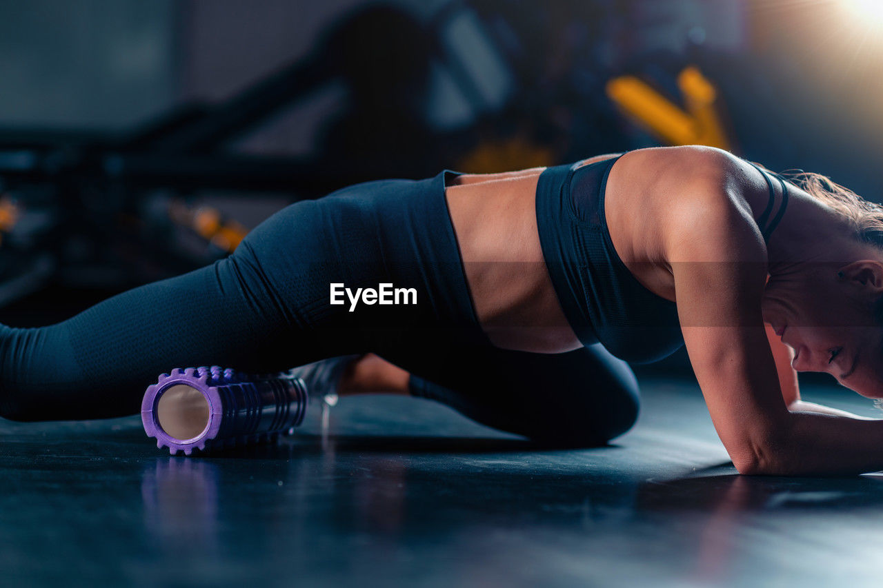 cropped hand of woman exercising in gym