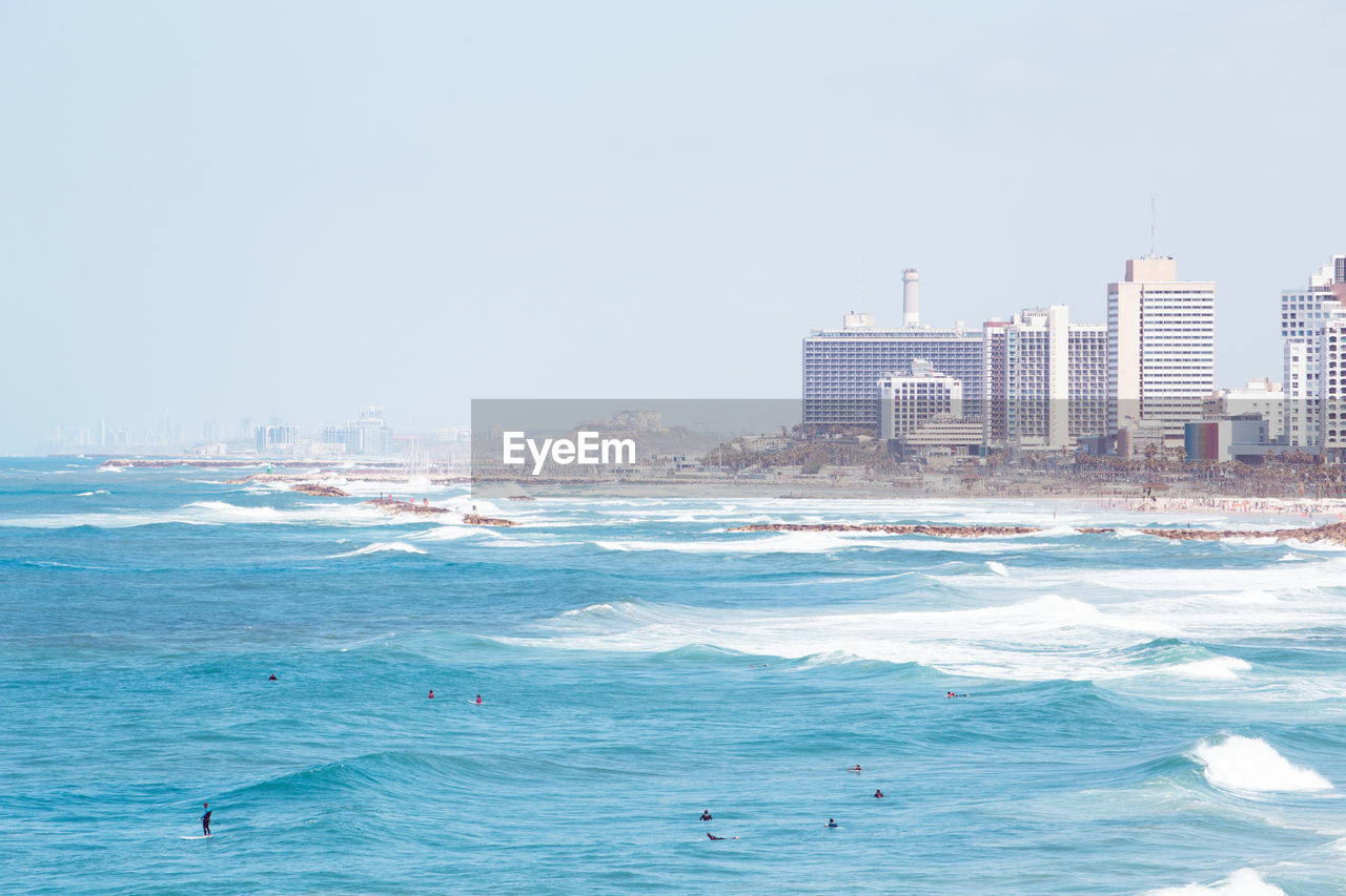 Group of surfers at tel aviv beach