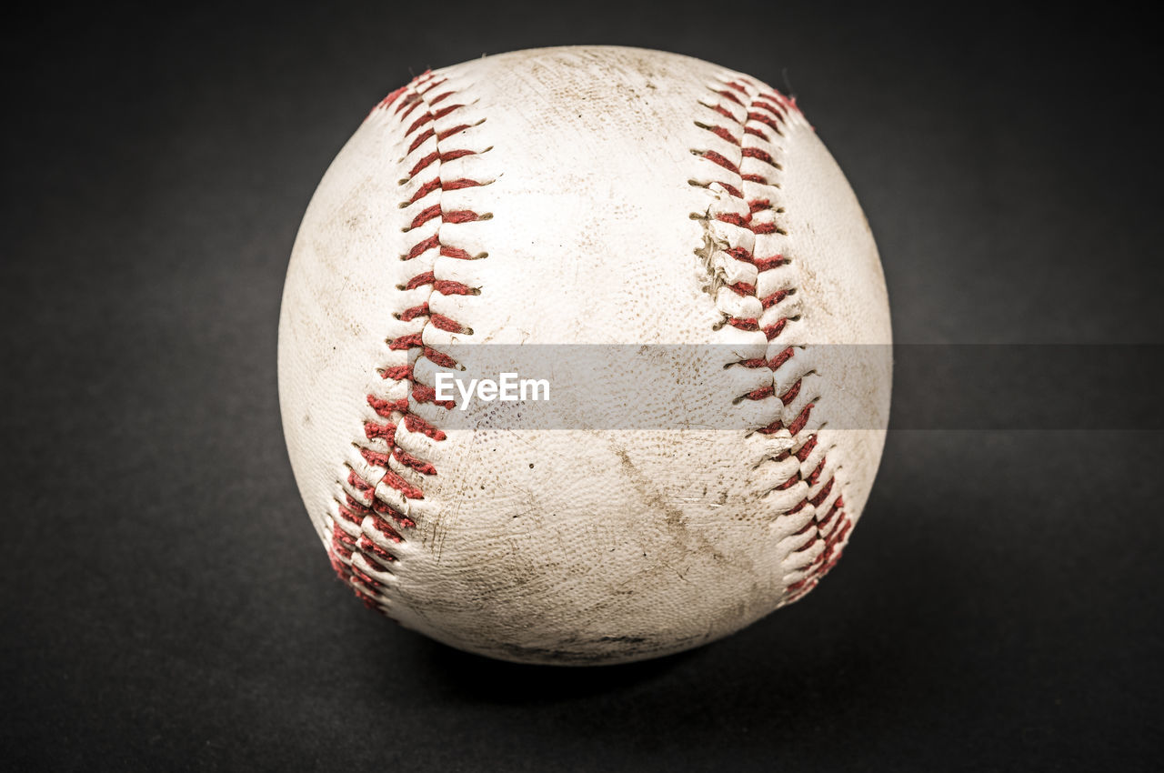 Close-up of ball against black background