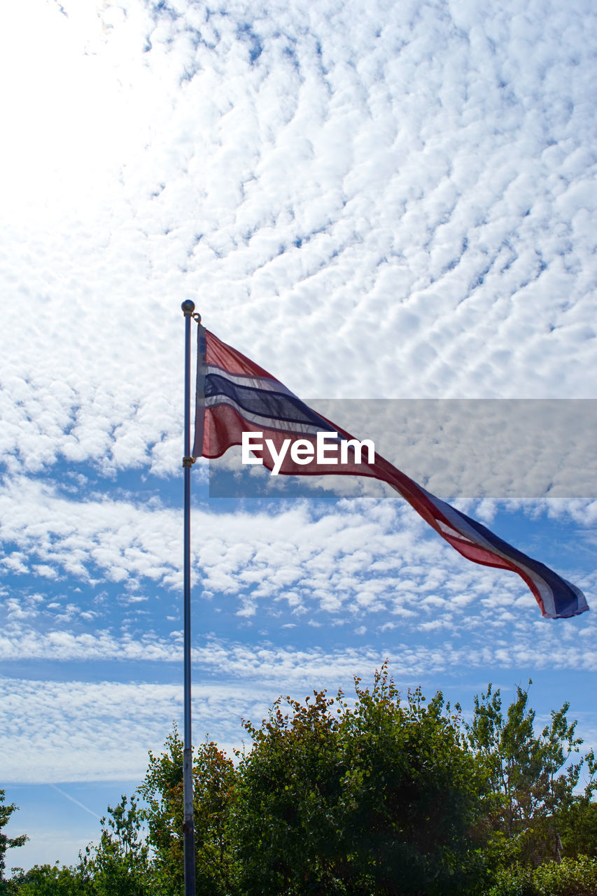LOW ANGLE VIEW OF FLAG AGAINST SKY
