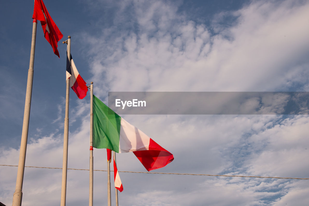 Low angle view of flag against sky